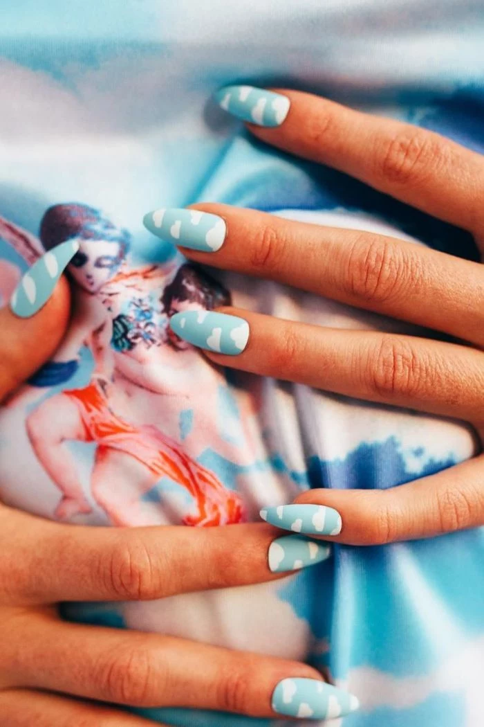 nail designs 2021 blue matte base white clouds decorations on long stiletto nails