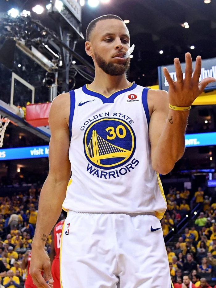 photo of steph looking at his hand wearing white warriors uniform stephen curry wallpaper hd