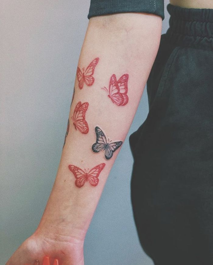 red and black butterflies flying butterfly tattoo designs forearm tattoo