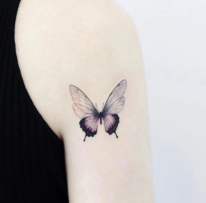 shoulder tattoo on the back of the arm simple butterfly tattoo half purple half blue butterfly