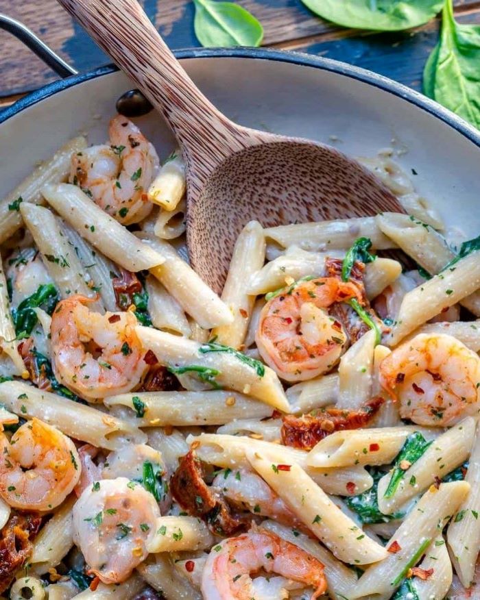 shrimp pasta with creamy sauce garnished with parsley how to make pasta from scratch