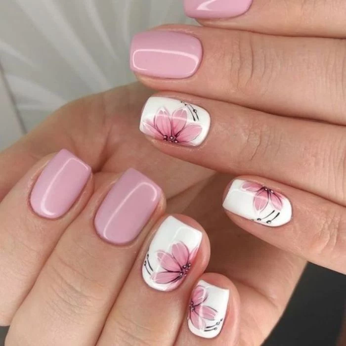 simple nail designs pink and white nail polish pink flower decorations on ring and pinky fingers