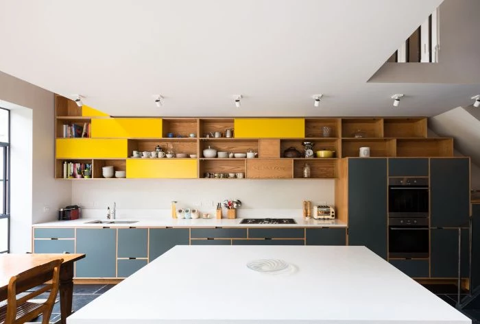 tiled floor in kitchen with black bottom cabinets kitchen with shelves instead of cabinets with yellow accents