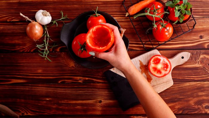 tomatoes with their insides taken out easy appetizers for a crowd placed in black bowl