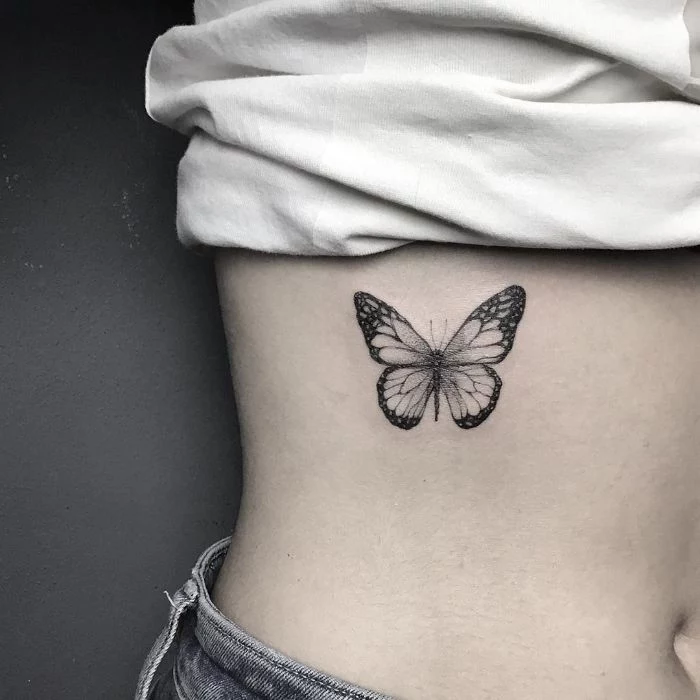 traditional butterfly tattoo black and white butterfly tattoo on the side of the rib cage