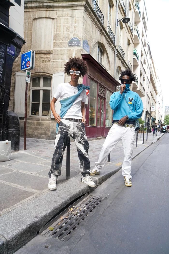 two men standing on the street streetwear clothing wearing different outfits