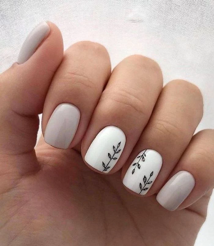 white and gray nail polish simple nail ideas small decorations of branches on ring and middle fingers