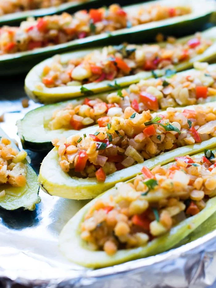 close up photo of summer squash stuffed with lentils and veggies how to cook squash and zucchini