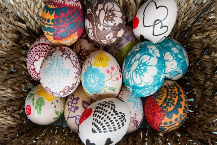 decoupage easter eggs placed inside a basket easter egg coloring colorful eggs
