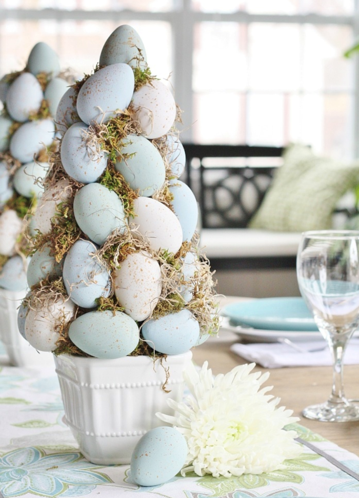 diy tree topiary easter decorations 2021 made with blue and white eggs and moss in white ceramic pot