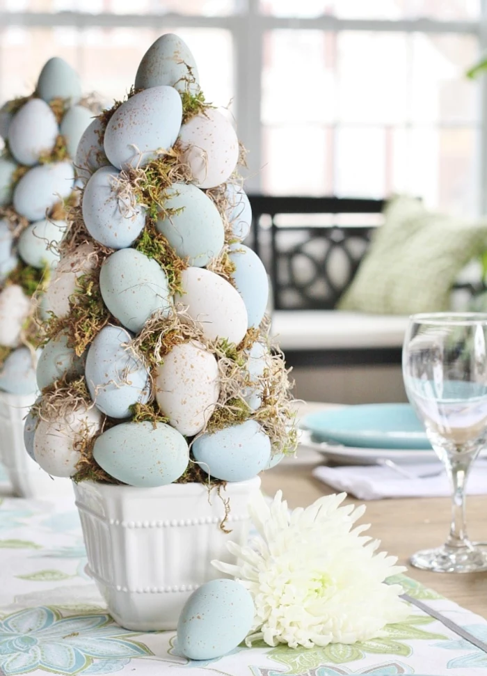 diy tree topiary easter decorations 2021 made with blue and white eggs and moss in white ceramic pot