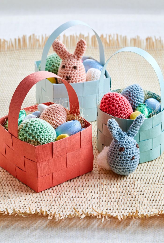 easter basket ideas crocheted bunnies and easter eggs inside baskets made from crepe paper