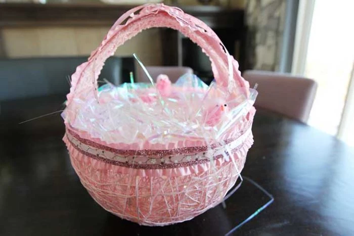 easter basket made of yarn homemade easter baskets placed on black wooden surface