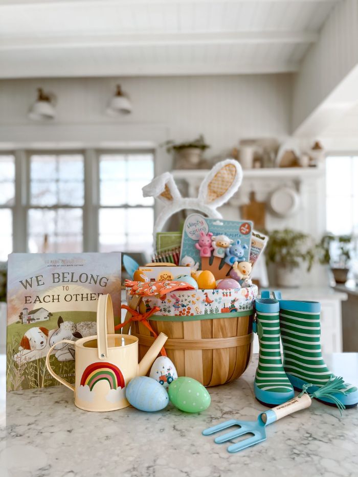 easter baskets for kids filled with plastic eggs toys childrens book candy placed on marble surface