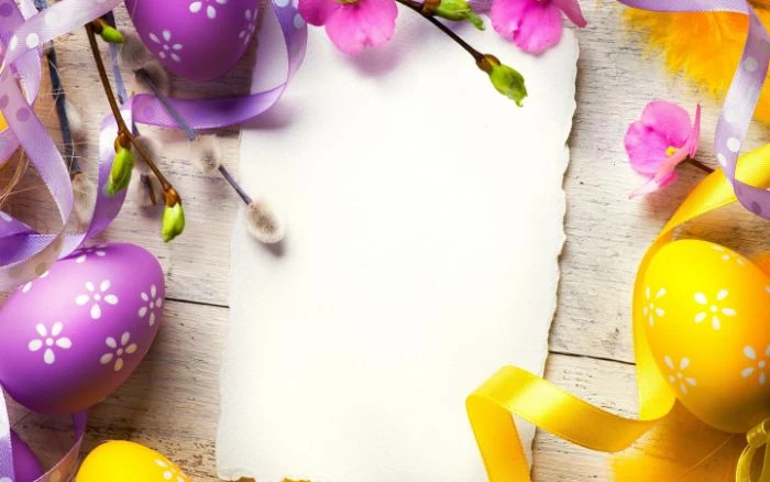 easter wallpaper purple and yellow eggs with white flowers drawn on them next to white piece of paper