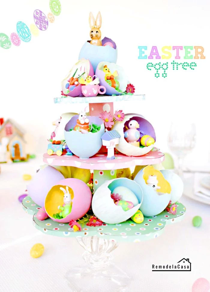 easy easter crafts tree centerpiece made from carton with egg shells and easter themed figurines