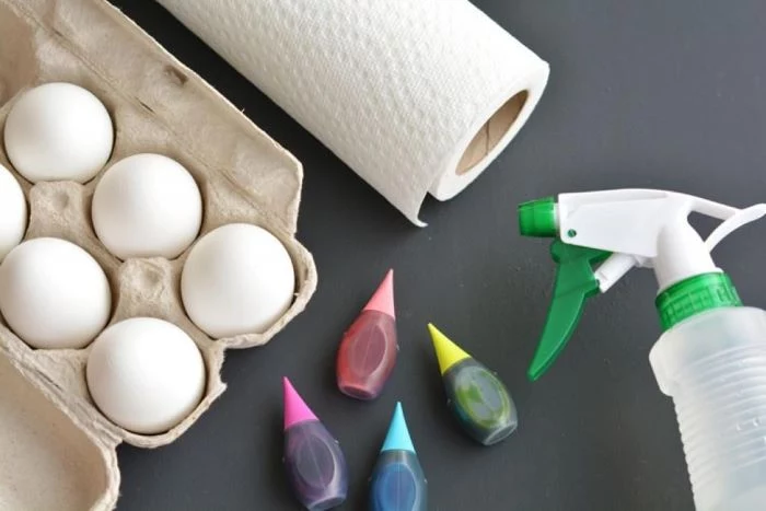 eggs dyed in different colors paper towels spray bottle with water how to color easter eggs step by step diy tutorial