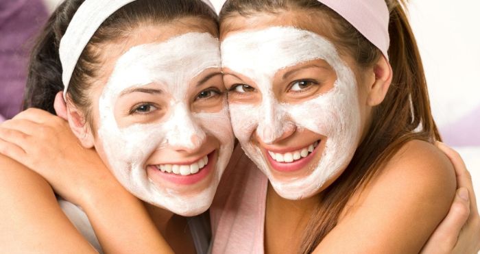 how to make a face mask for skin two girls wearing white head bands white face masks