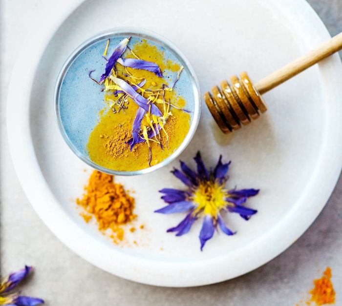mask made with honey and turmeric mixed blue and yellow homemade face masks white bowl