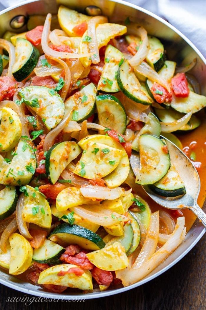 squash zucchini onion and tomatoes yellow squash recipes cooked in buttery sauce in saucepan