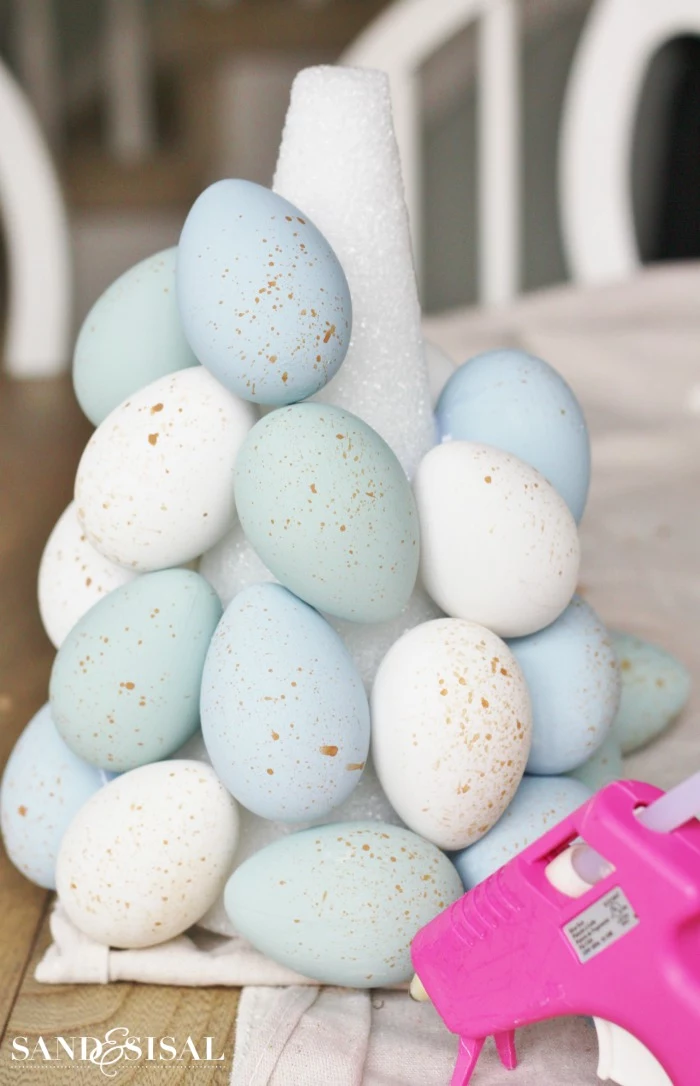 step by step diy tutorial easter decorations 2021 attaching eggs to topiary centerpiece