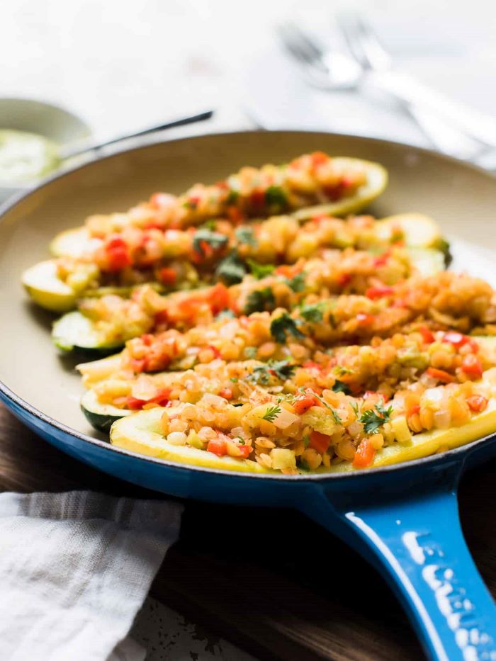 stuffed summer squash in saucepan how to cook squash and zucchini filled with veggies and lentils