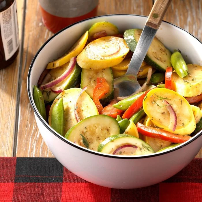 summer salad with squash zucchini onion peppers in white bowl how to cook squash