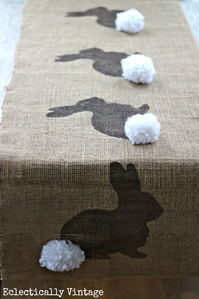 table runner made from burlap easter table décor bunny pattern with white pom poms
