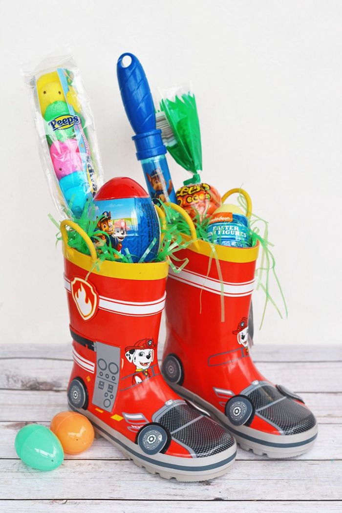 two kids boots filled with different candy easter basket ideas easter toys inside