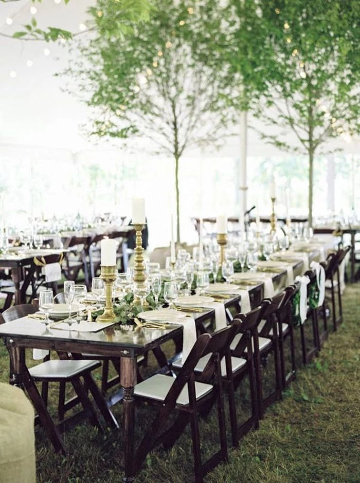 white napkins on black wood table with black wood chairs backyard wedding ideas minimalistic decor