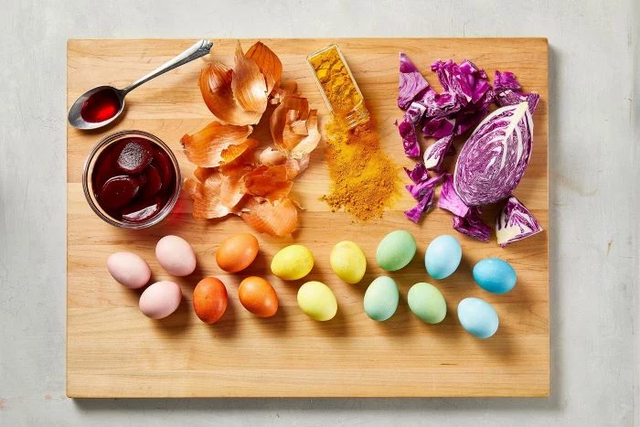 wooden board with eggs and ingredients how to dye eggs naturally with onion beetroot turmeric cabbage