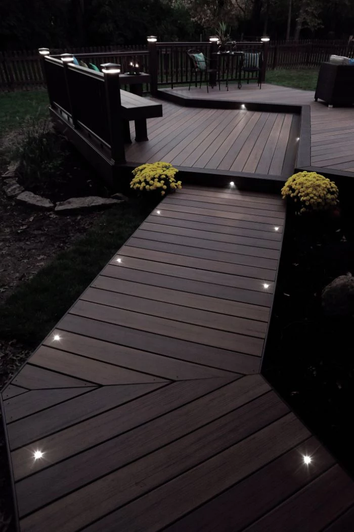 backyard lighting ideas back patio with dark wood and fence small lights along the pathway