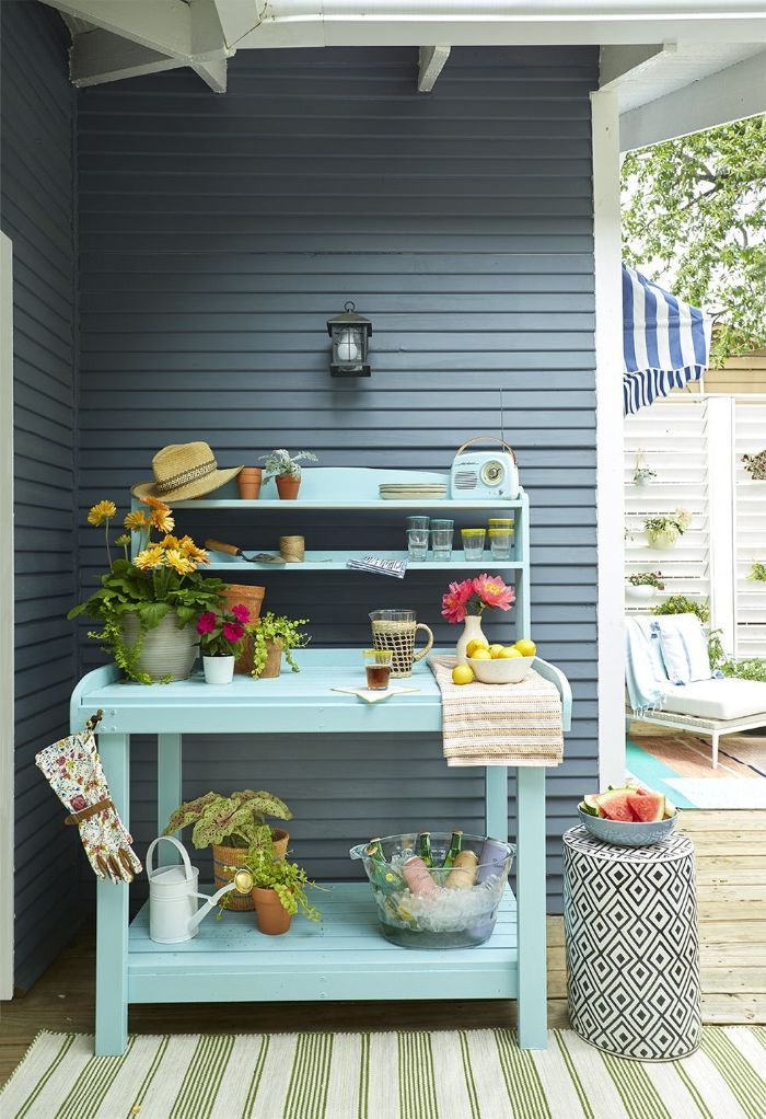 blue cart with potted plants outside bar ideas bowl of ice with bottles inside glasses and bowl of lemons