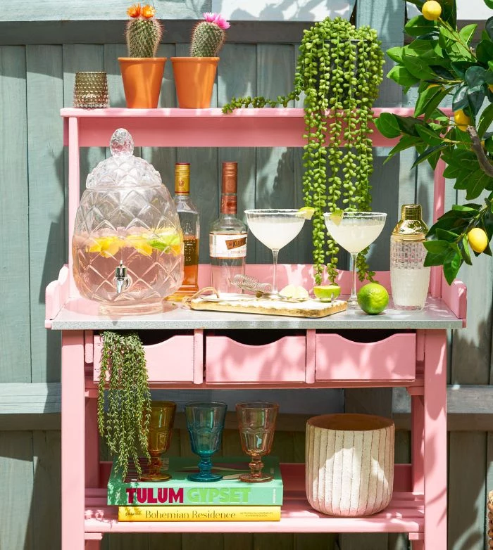 bottles and different glasses pitcher on pink cart with shelves drawers how to build an outdoor bar