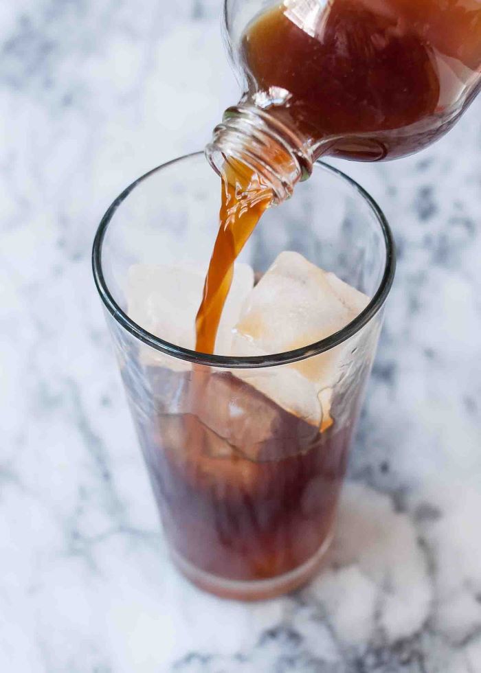 coffee being poured inside tall glass filled with ice cubes how to make coffee without a coffee maker