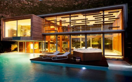 contemporary house with large pool small inground pool cost deck with lounge chairs and jacuzzi