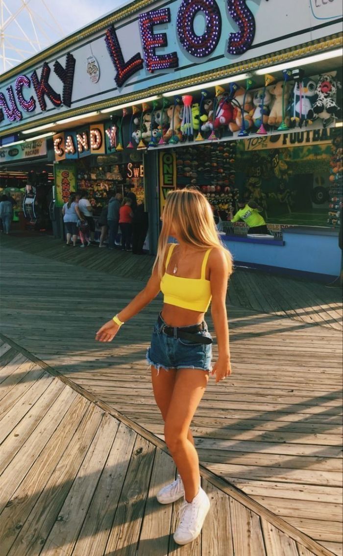 denim shorts yellow crop top white sneakers cute outfits for girls worn by girl with blonde hair