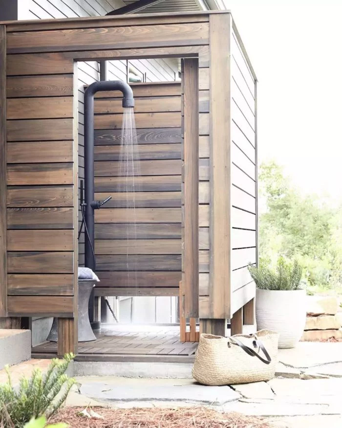 diy outdoor shower wood enclosure in industrial style with metal black pipe for shower