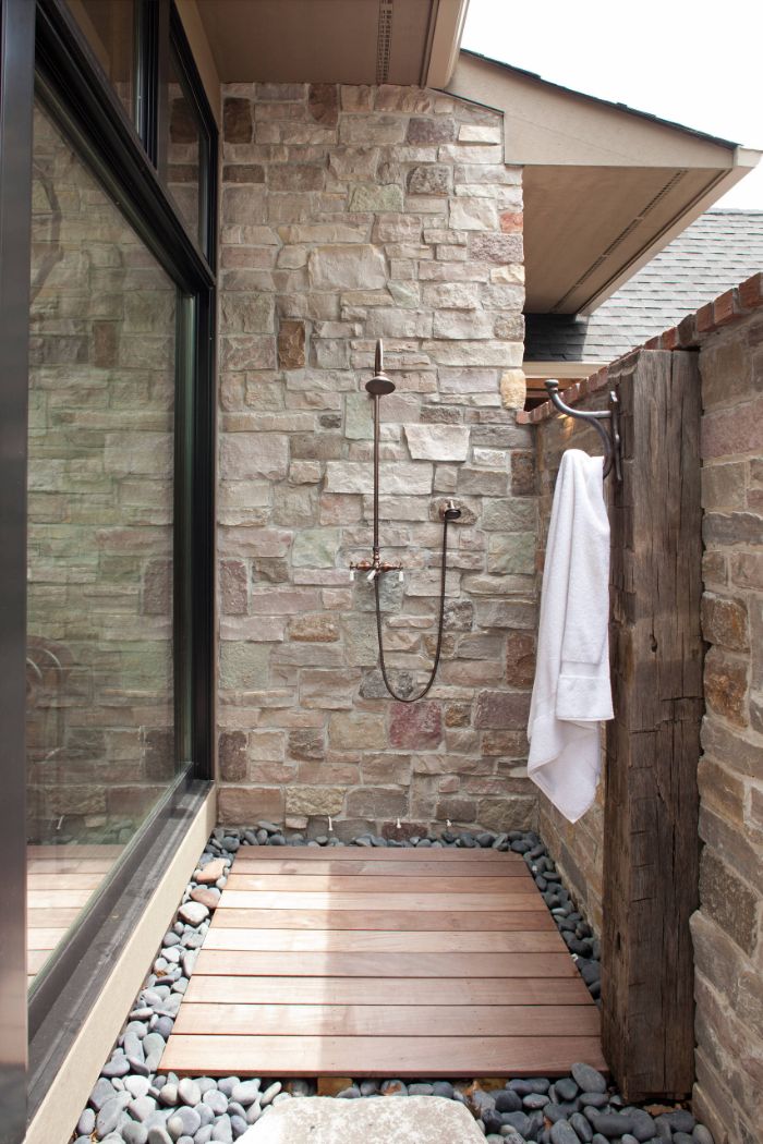 hook for towel outdoor shower designs shower mounted on stone wall wood floor with rocks around it