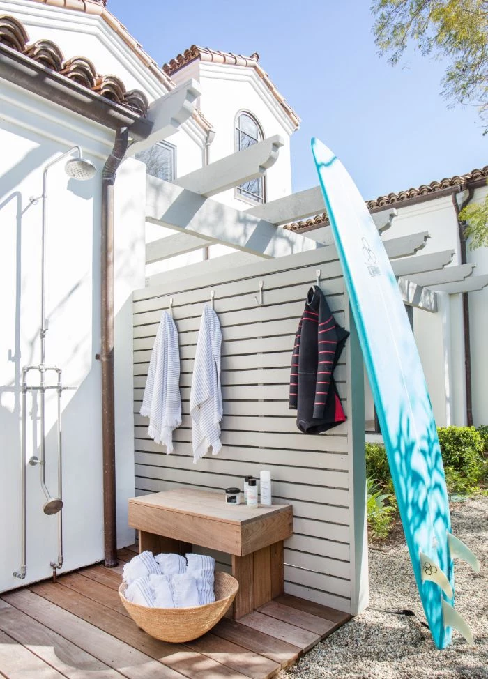 hooks for towels wet suit freestanding outdoor shower surf leaning on the wall wood floor