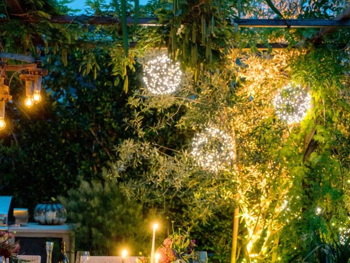 how to hang outdoor string lights three balls made of fairy lights hanging from large tree