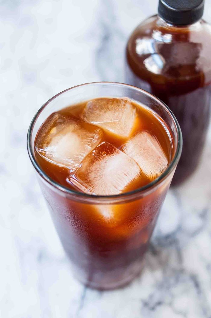 how to make coffee without a coffee maker glass filled with coffee and ice placed on marble surface