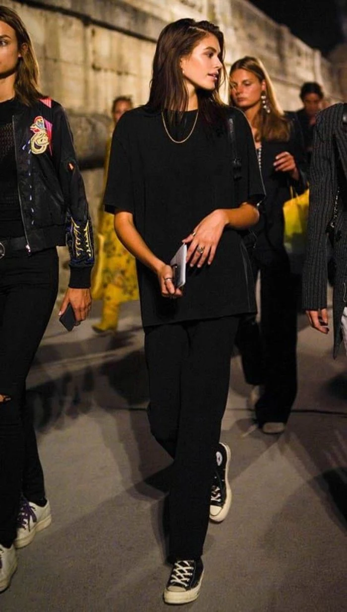 kaia gerber wearing black trousers oversized black t shirt clothes for teenage girls black converse shoes