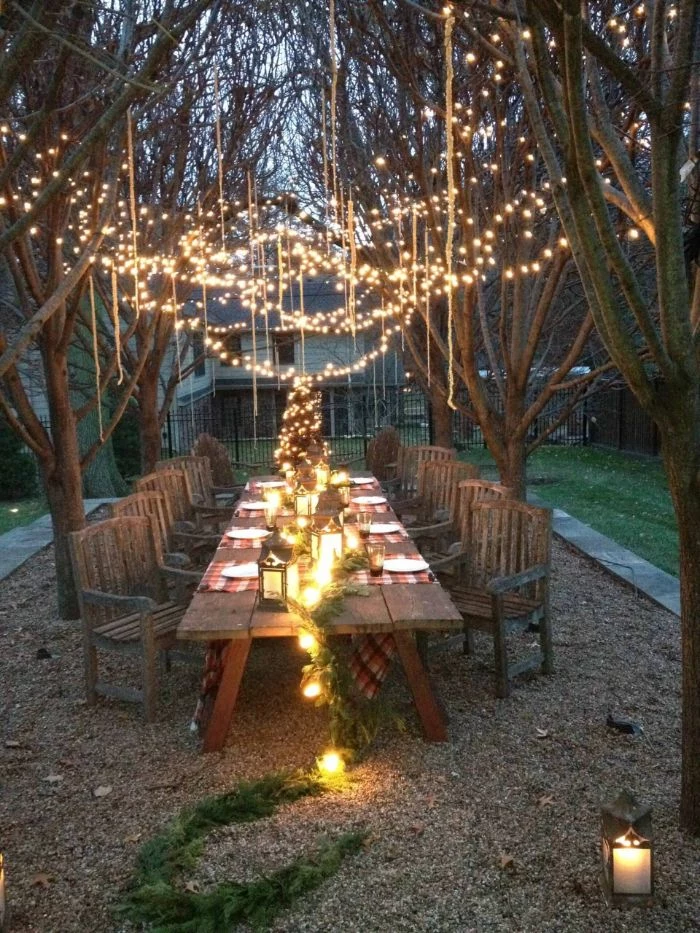 large dining table with chairs how to hang string lights on covered patio lots of string lights and fairy lights hanging from the trees