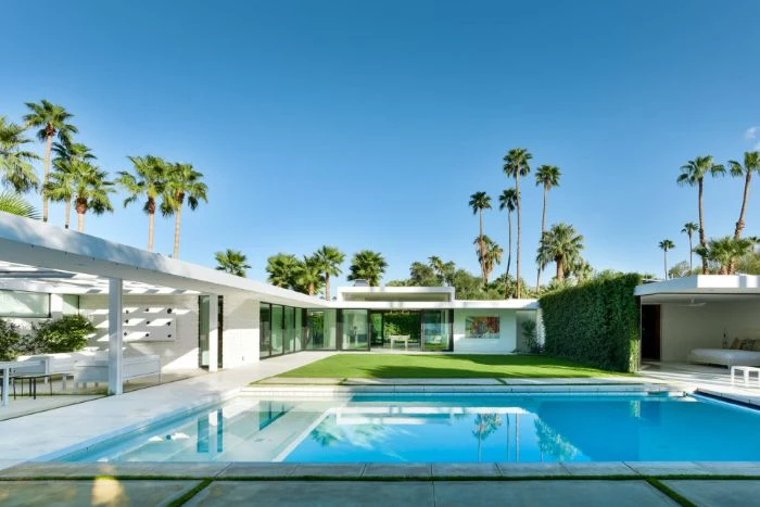large pool in contemporary house with green garden backyard inground pools lots of palm trees