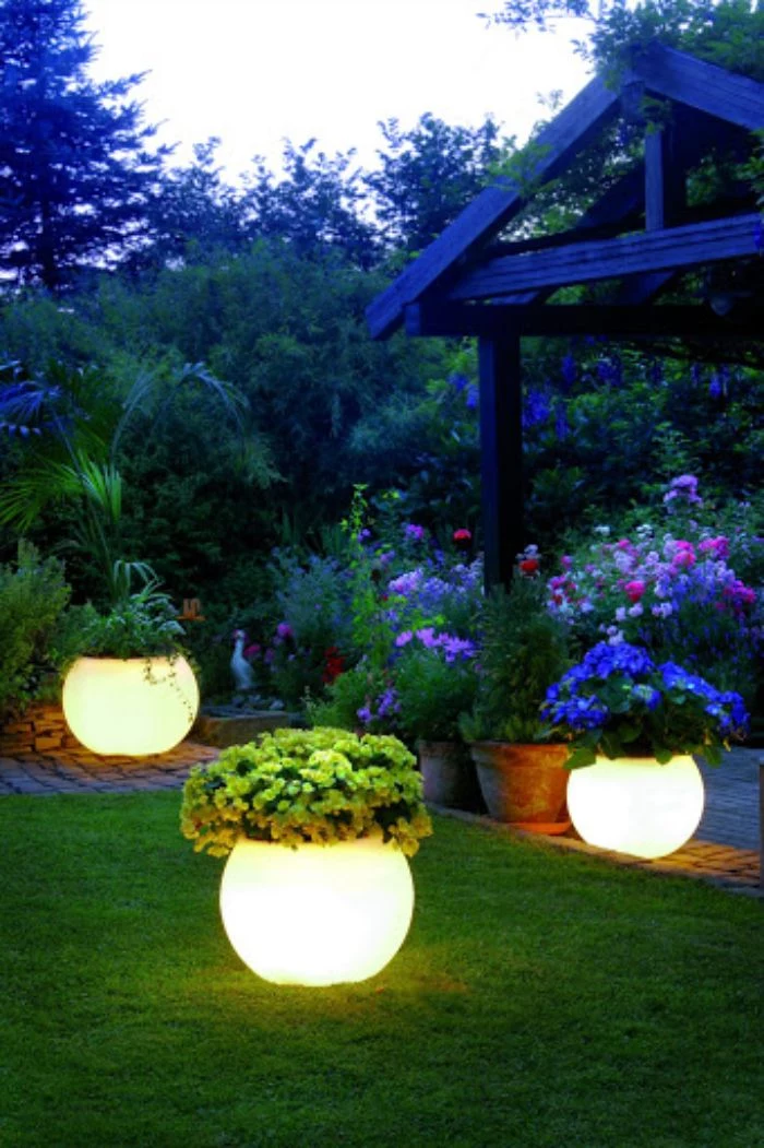 led planters scattered around a grass field next to gazebo how to hang string lights on covered patio flower beds