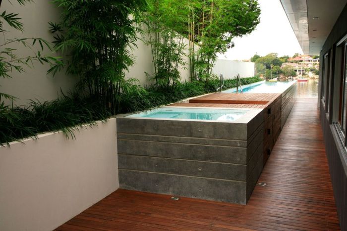 long above ground pool with small built in deck small inground pool cost surrounded by trees and bushes