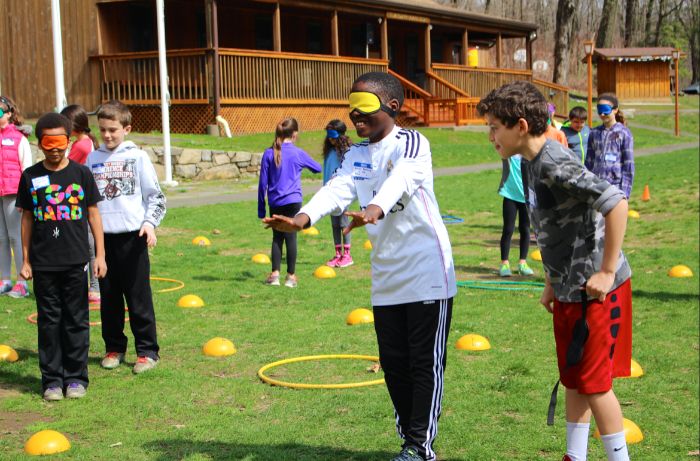 lots of kids outdoor games for kids half of them blindfolded the other half running