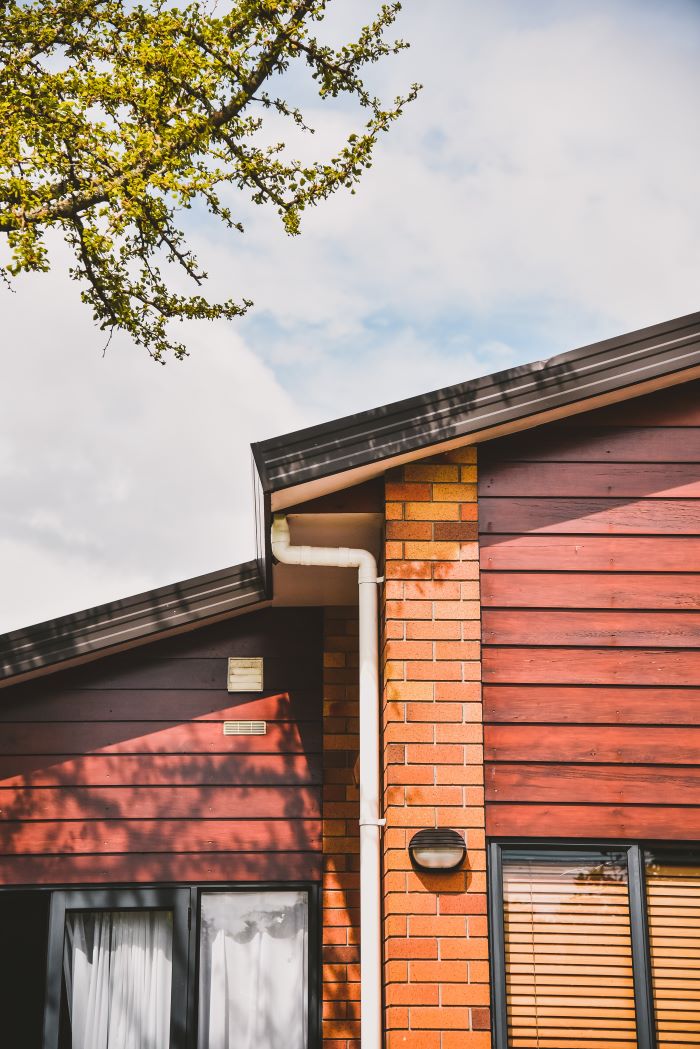 one storey house with wood siding brick decorations home siding black window frames