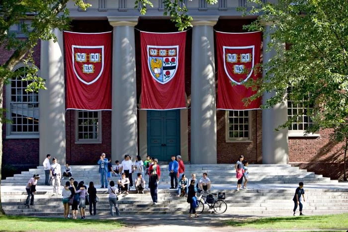 photo of the front entrance of harvard university best places to study architecture students standing outside